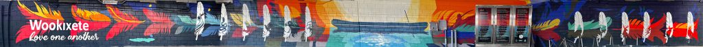 a full shot of Ho-chunk mural painted under the Main Street (Ray Nitschke Memorial) Bridge for Green Bay Art Fest 2024